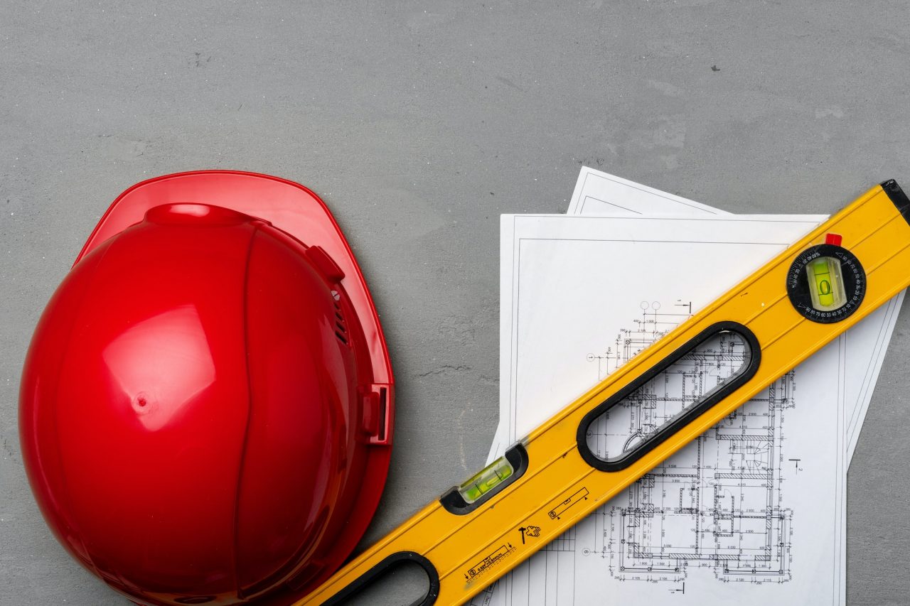 construction-worker-hardhat-blueprints-and-construction-level-top-view.jpg